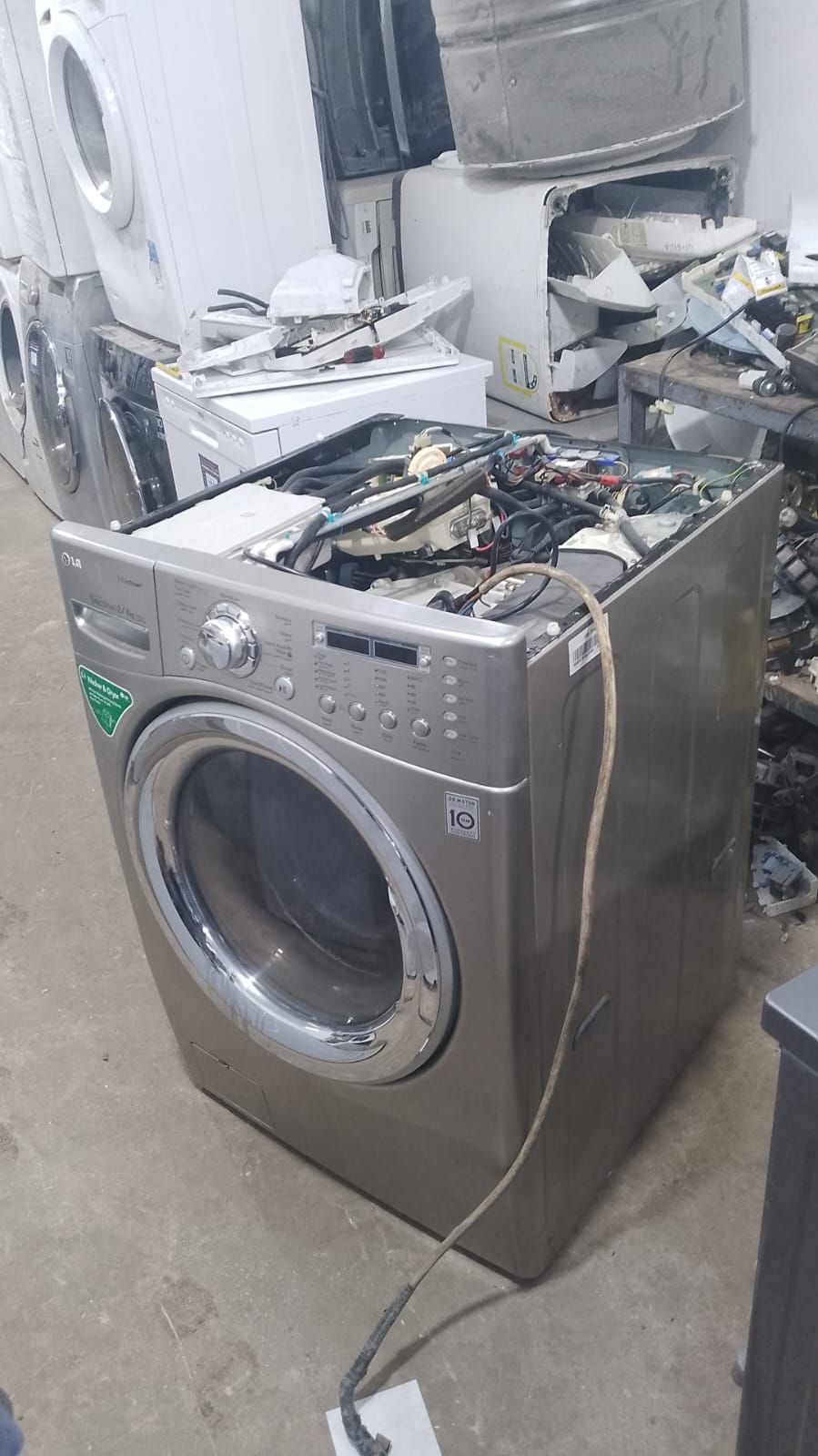 LG washing machine stripped down for spare parts at our workshop